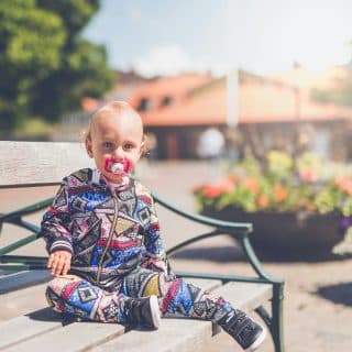 Baby sitting on a bench